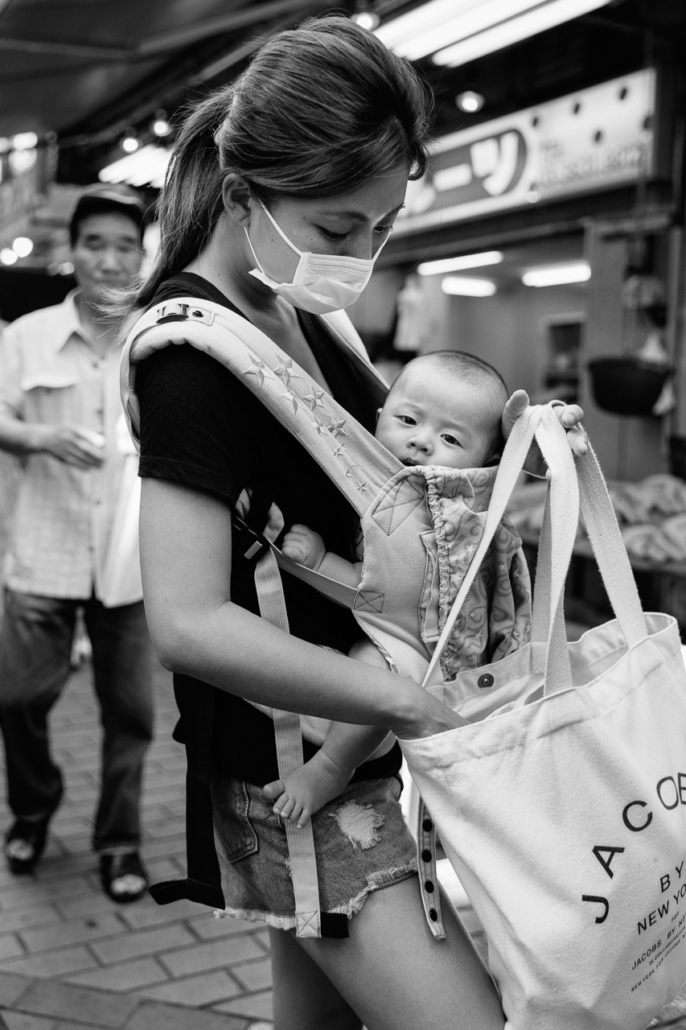 Motherhood. Ameyoko shopping street, Ueno, Tokyo, Japan.