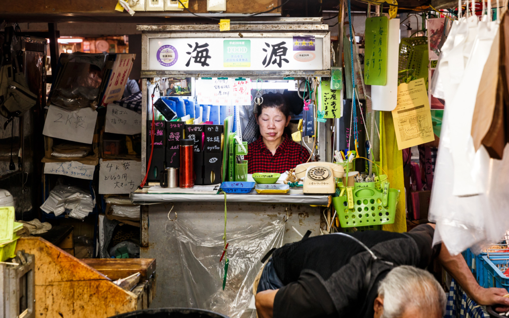 A (bored) saleswomen in Tsukiji Market, Tokyo, Japan.