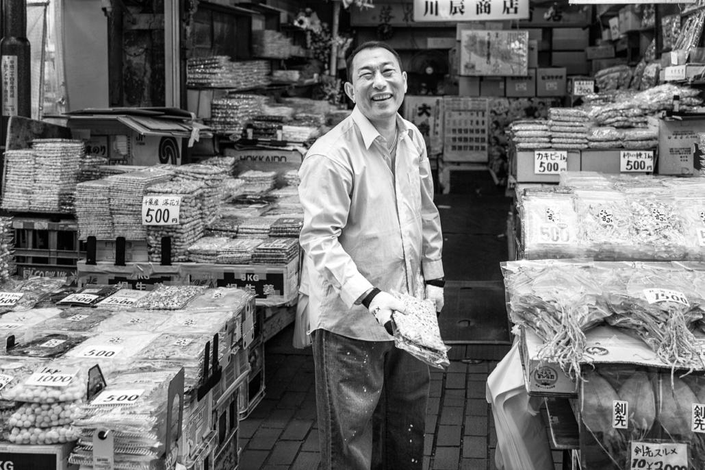 Smily dry fish seller in Ameyoko shopping street, Ueno, Tokyo, Japan.